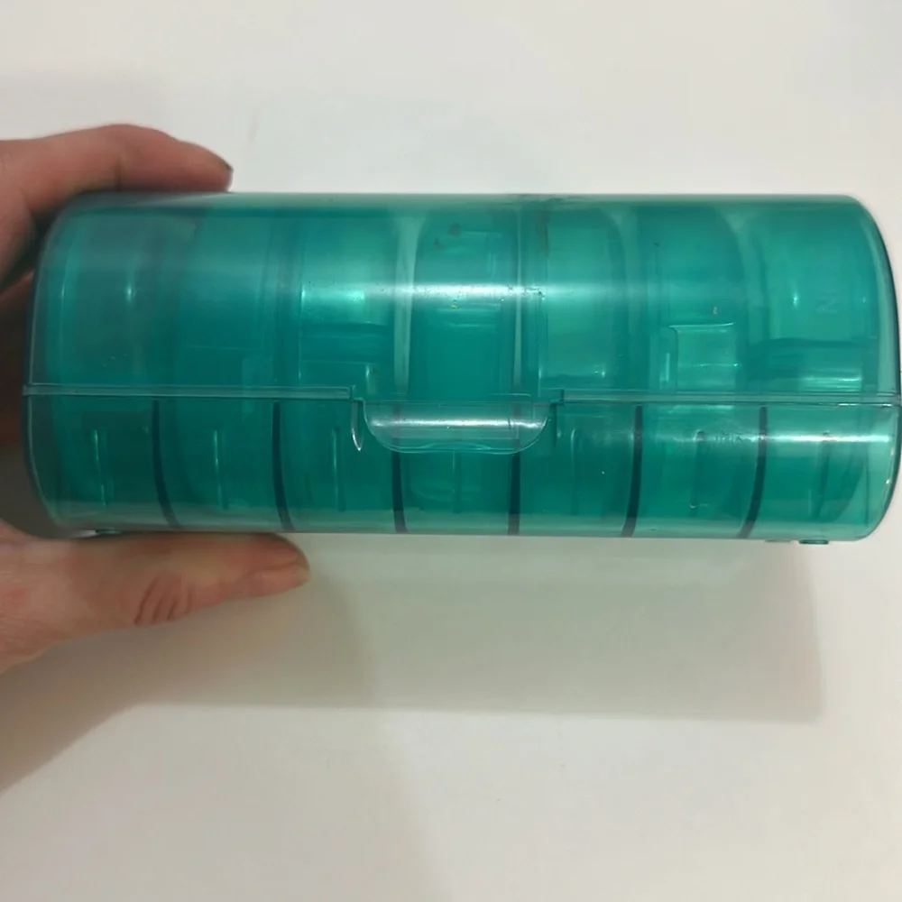 Pill organizer has 7 cute containers for each day of the week
